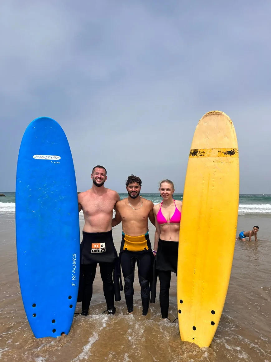 Surf trip guests with their boards